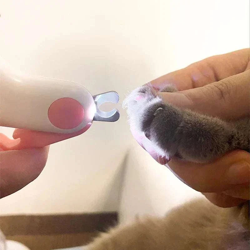 LED light pet nail clipper with safety lock and stainless steel blades for precise grooming of cats and dogs