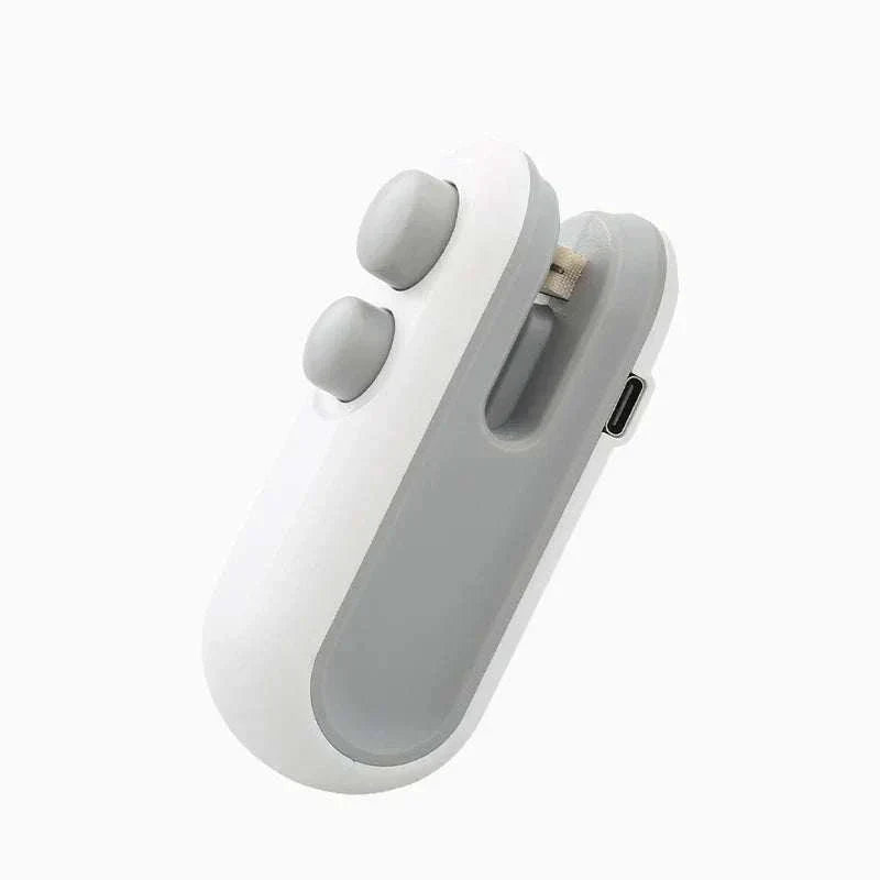 Compact mini heat bag sealing machine for airtight food storage, rechargeable and portable handheld sealer.