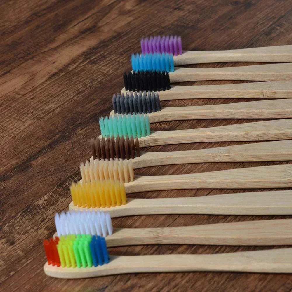 Ten-piece natural bamboo toothbrush set with black charcoal bristles, eco-friendly and biodegradable.