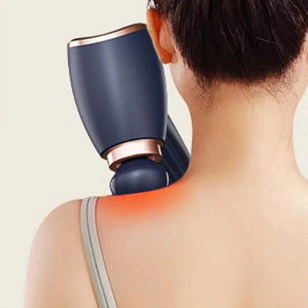 Handheld electric massage gun delivering deep tissue percussion therapy on shoulder and neck muscles