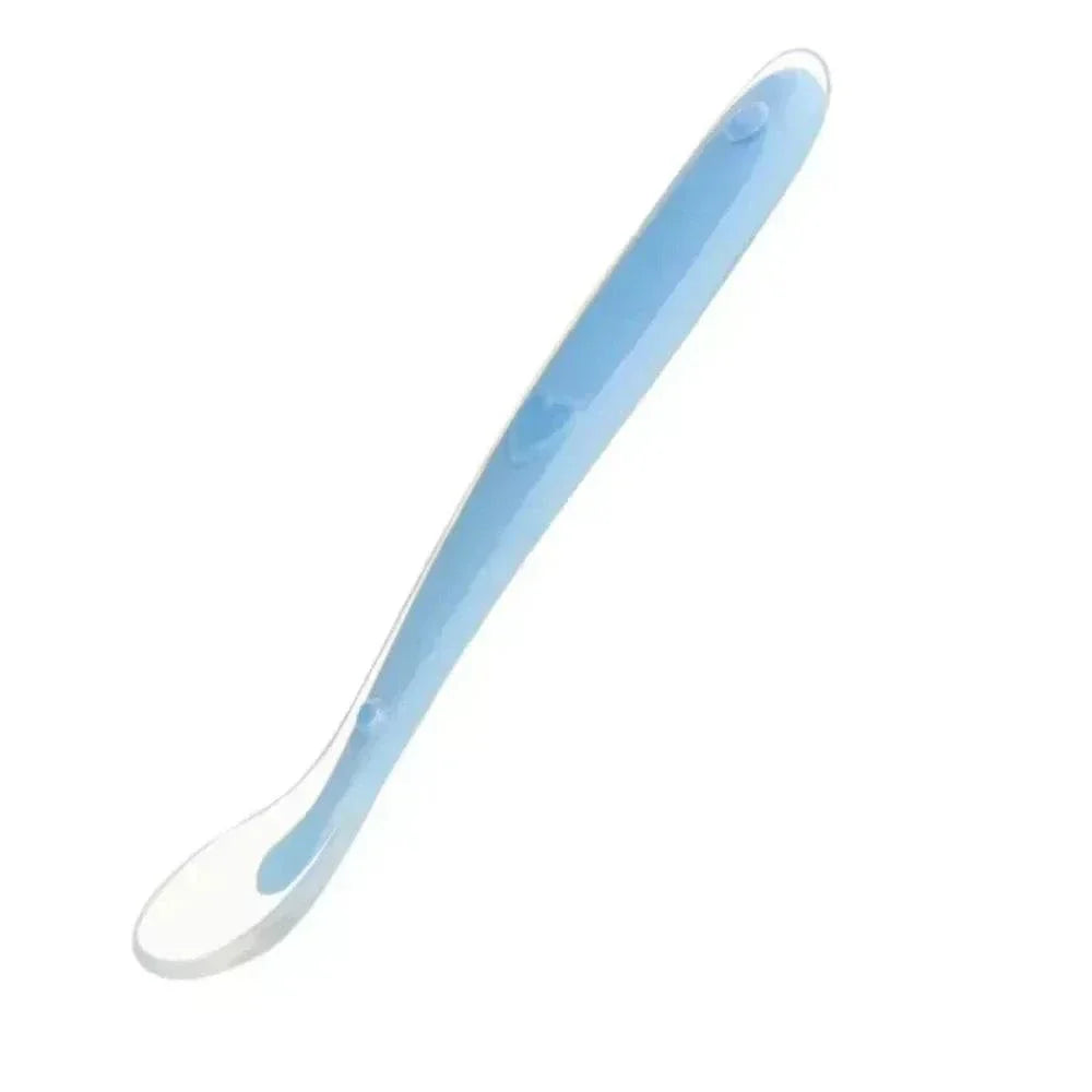 Blue and white silicone spoon for baby feeding, soft and BPA free infant utensil