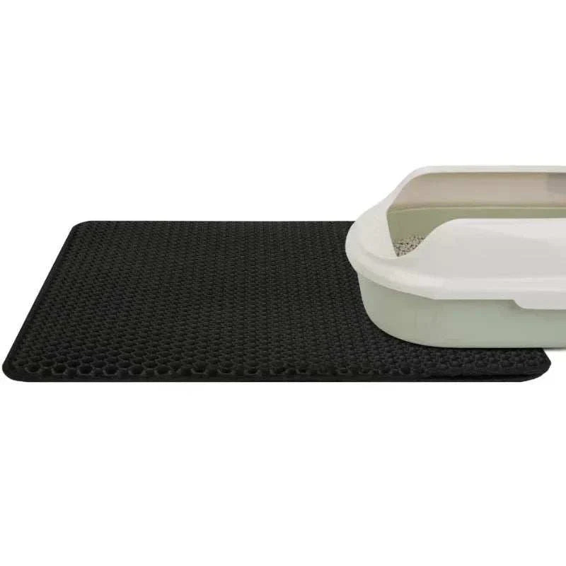 Double layer waterproof cat litter mat with honeycomb surface and anti-slip backing designed to trap scattered litter and prevent messes.