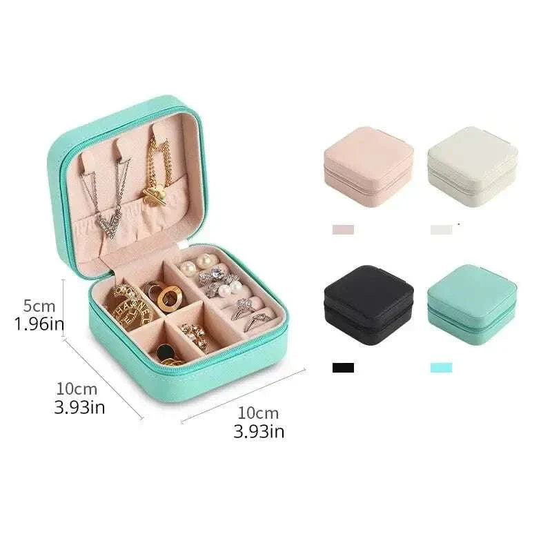 Compact mini jewelry box with compartments for earrings, rings, and necklaces in multiple colors, portable PU leather travel organizer.