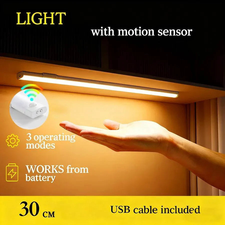 Wireless LED cabinet light with motion sensor, rechargeable battery, 30cm length, and USB cable included.