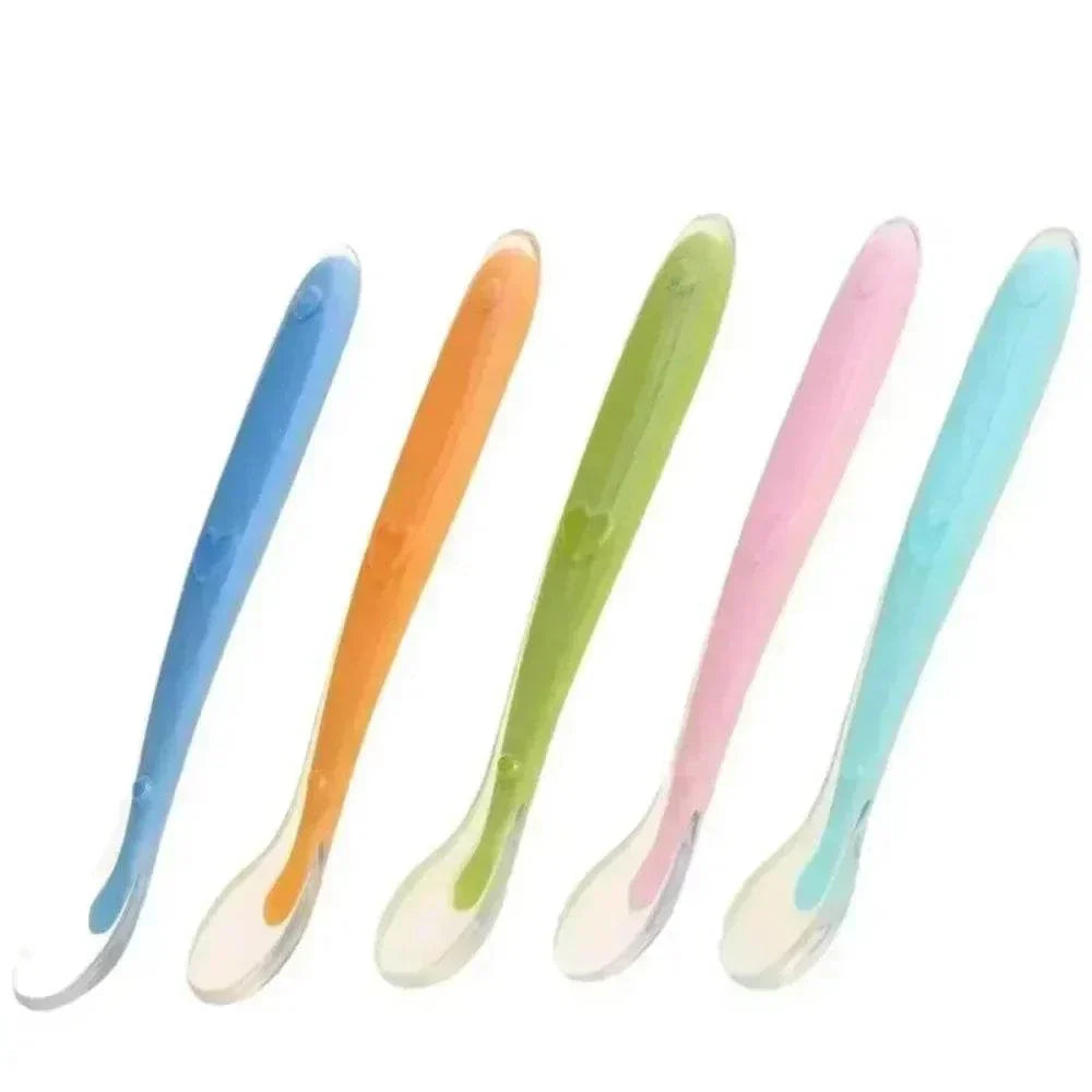 Set of soft silicone spoons for baby feeding in multiple colors, BPA free and safe for infants and kids.