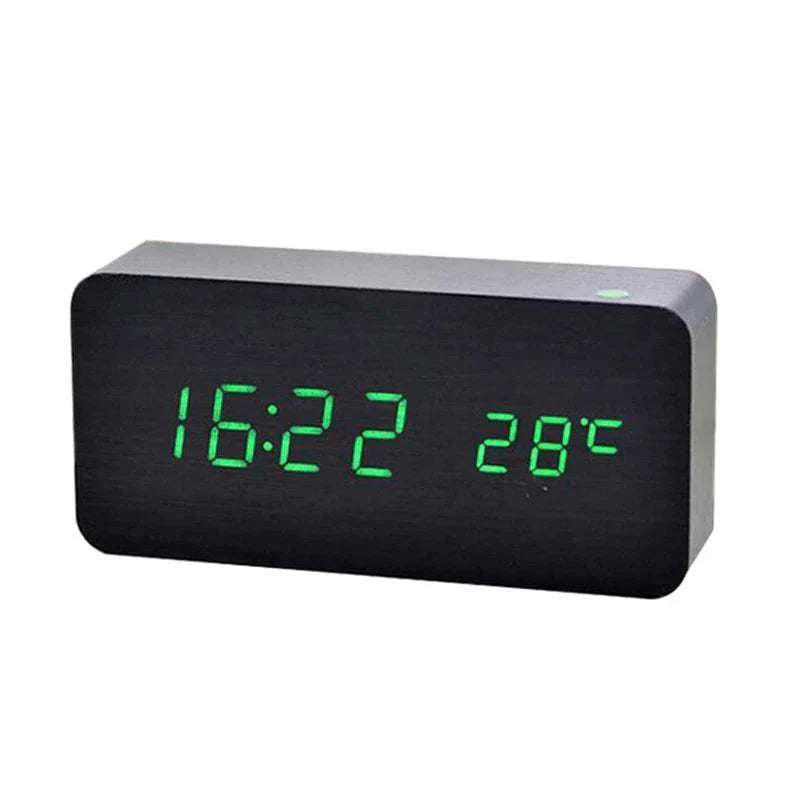 Wooden digital alarm clock with LED time and temperature display on desk