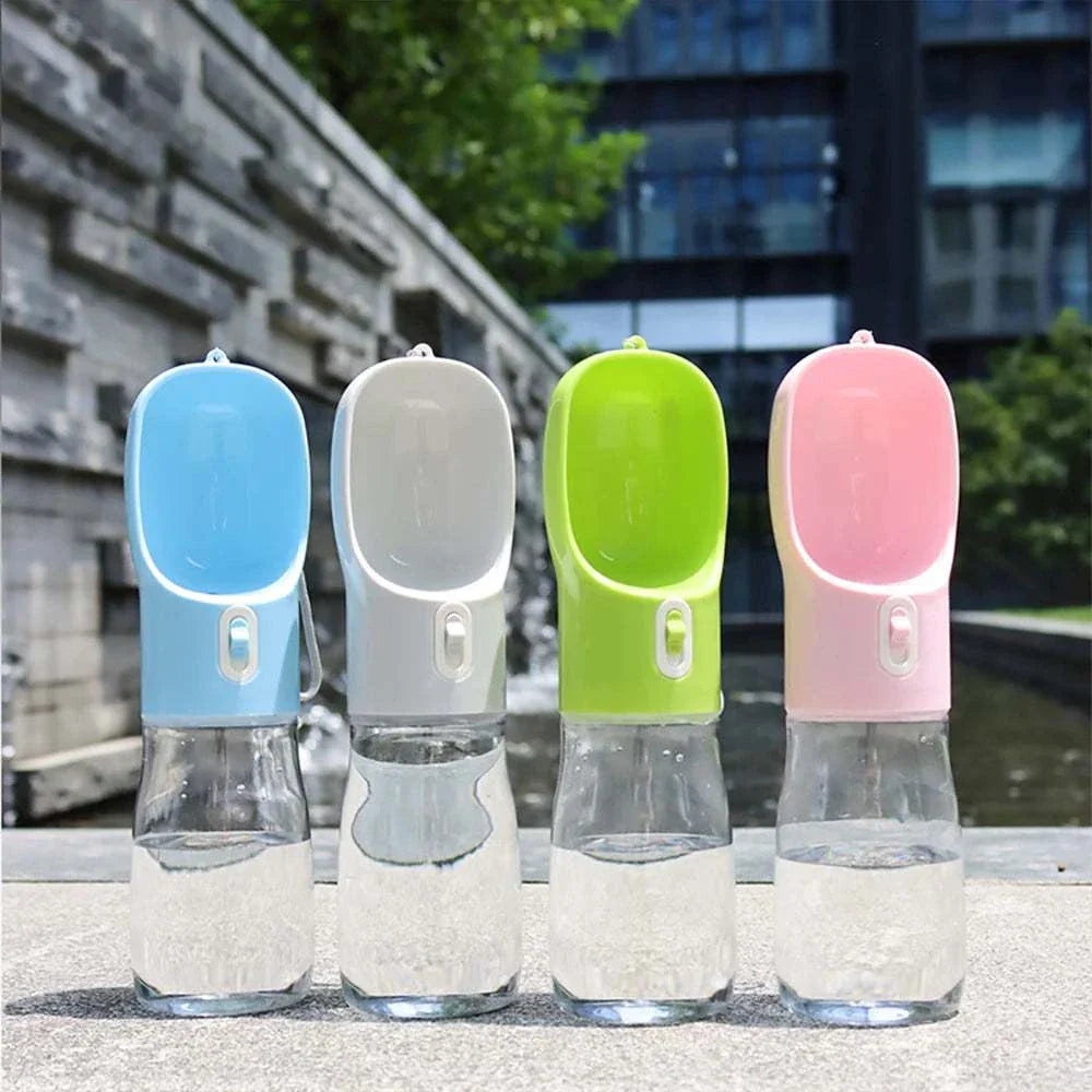 Set of portable dog water bottles in blue, gray, green, and pink for travel and outdoor use with leakproof design