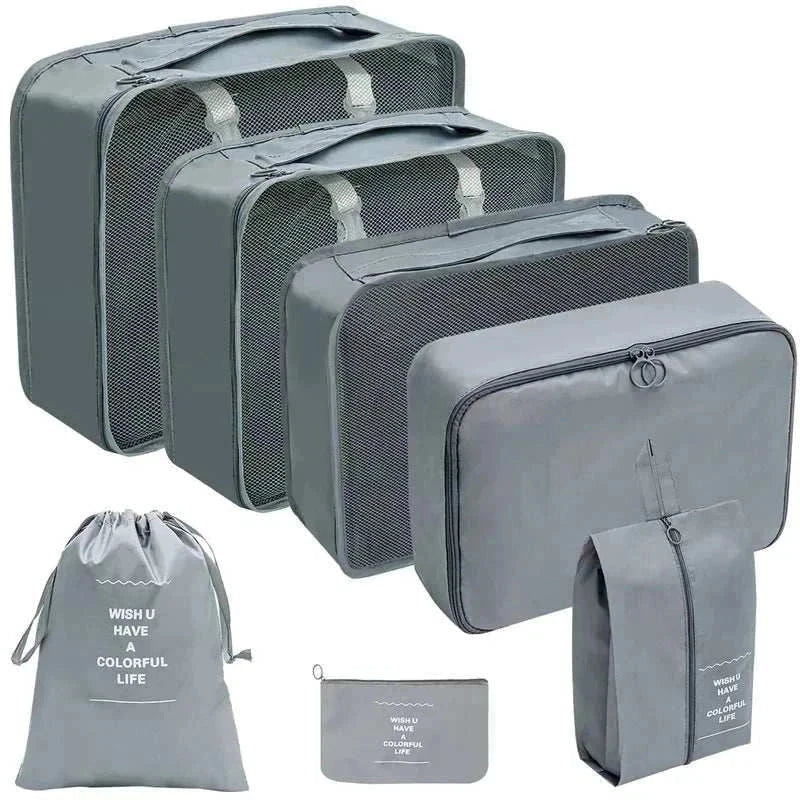 Set of portable travel organizer storage bags in various sizes for luggage organization