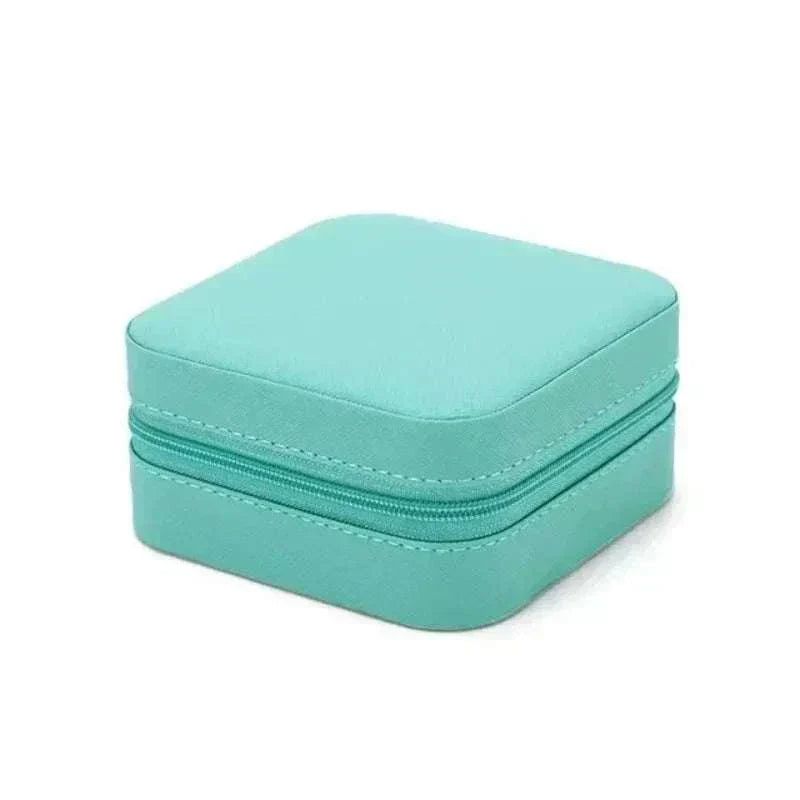 Compact turquoise mini jewelry box with zipper closure for travel and storage