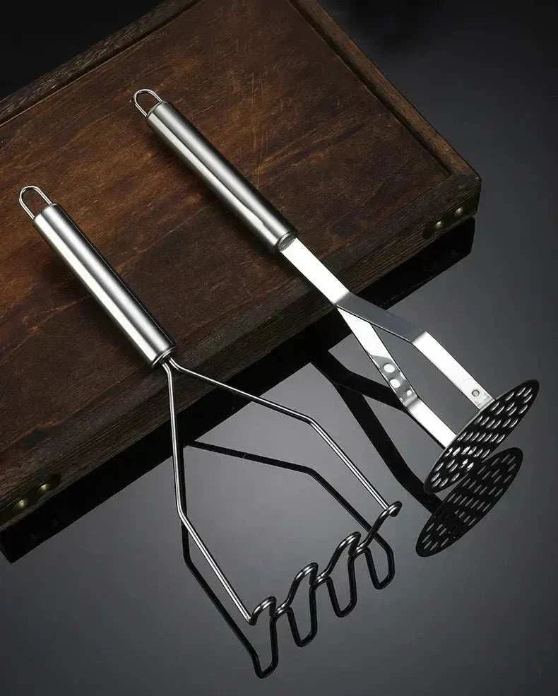 Stainless steel potato masher with ergonomic grip and rounded wire head for smooth mashing. Stainless Steel Potato Masher