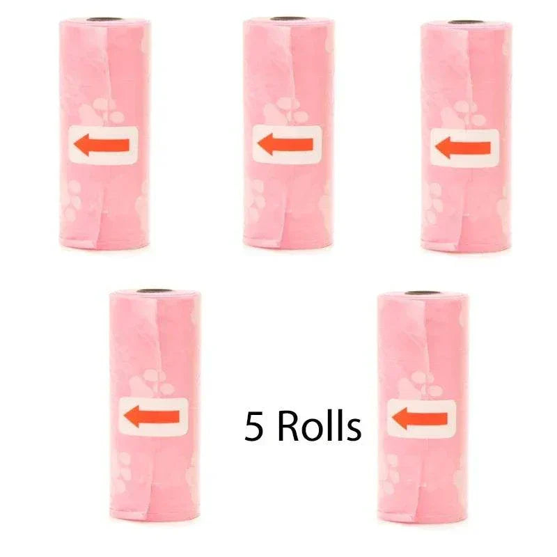 Five rolls of pink pet poop bags with paw prints for dog waste cleanup