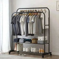 Heavy metal double clothes rail with rolling storage shelf and caster wheels for versatile wardrobe organization