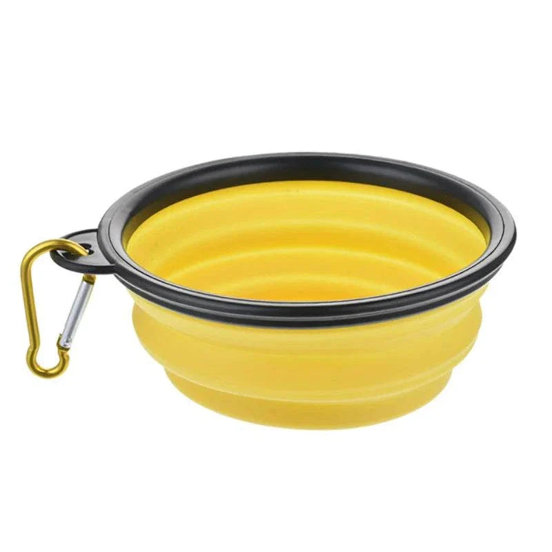 Yellow collapsible pet dog bowl with carabiner hook for outdoor travel and camping