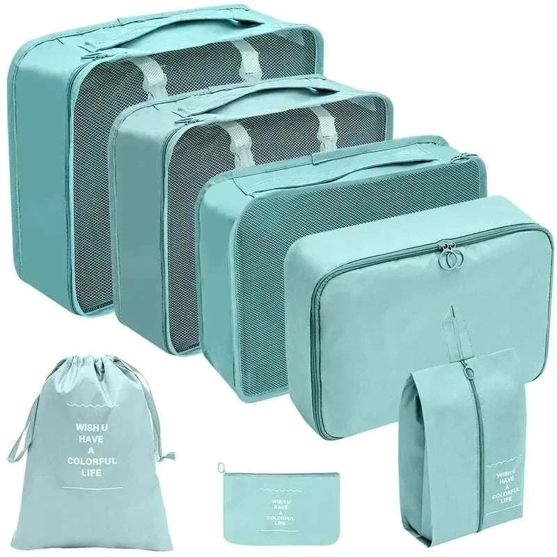 Set of portable travel organizer storage bags in various sizes for luggage organization