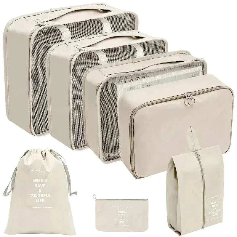 Set of portable travel organizer storage bags in various sizes for luggage organization