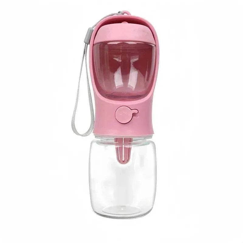 Pink portable dog cat water bottle with built-in food and water container for outdoor pet travel