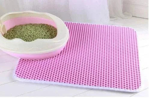 Double layer waterproof cat litter mat with honeycomb surface and non-slip base for trapping litter and preventing messes.